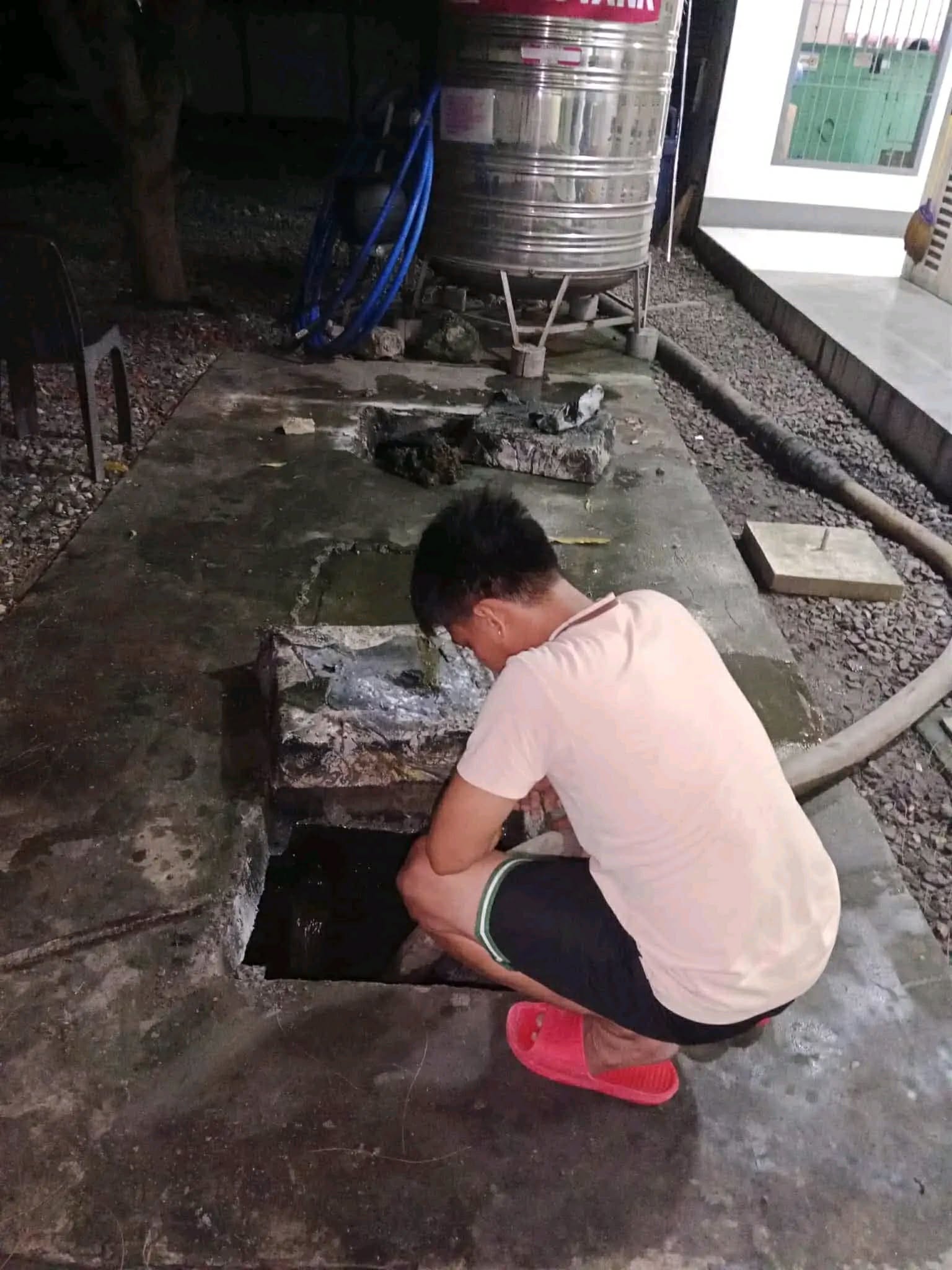 Person performing siphoning service